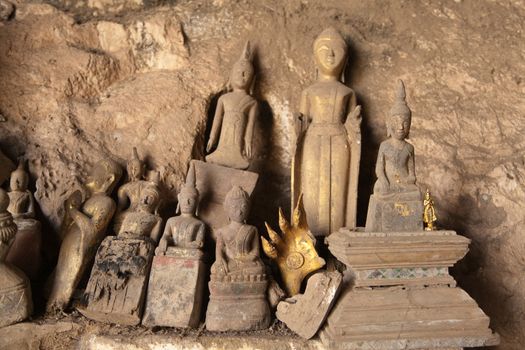 Ou Pak Caves Laos two caves on the west side of the Mekong river, with small and miniature Buddha statues in many different poses placed there for safe keeping and are frequently visited by tourists.. High quality photo