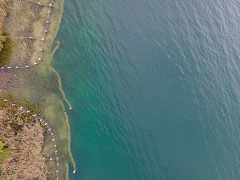 Drone shot over water. Background of lake. Birds view