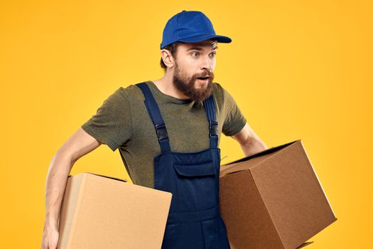 working man with box in hands delivery loading transportation service. High quality photo