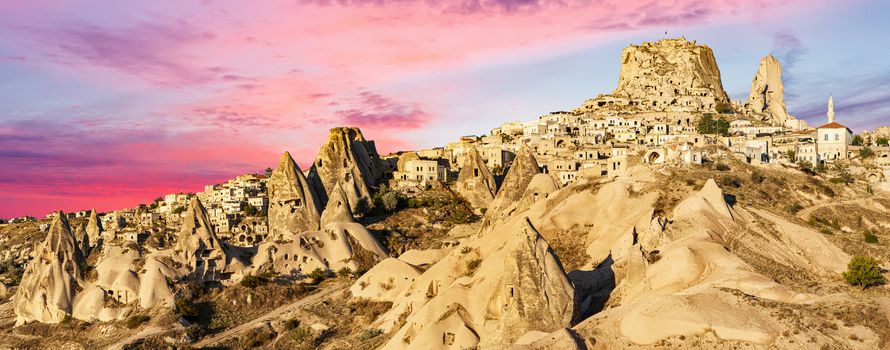 Panoramic photo of Uchisar castle after the sunrise. Cappadocia in Turkey