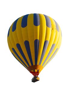 Yellow and blue hot balloon with tourists isolated on a white background