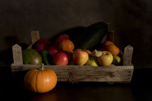 a still life of fruit in an old wooden box with a brown and black mixed background