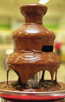 black chocolate fountain, close up, macro