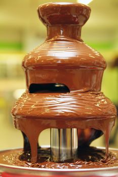 black chocolate fountain, close up, macro