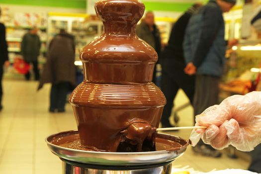 black chocolate fountain, close up, macro