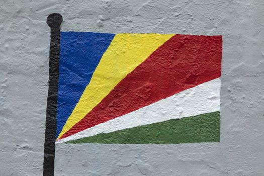 Childish style drawing, of the flag of Seychelles, painted on a wall.