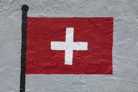 Childish style drawing, of the flag of Switzerland, painted on a wall.