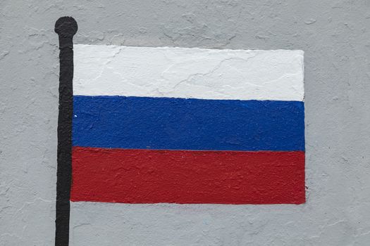 Childish style drawing, of the flag of Russia, painted on a wall.