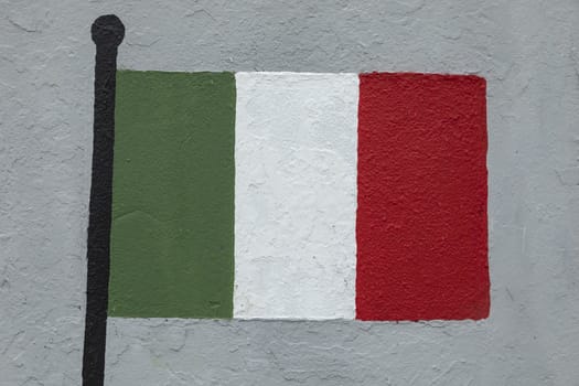 Childish style drawing, of the flag of Italy, painted on a wall.