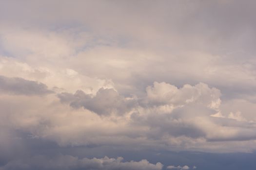 Clouds in the blue sky indicate the arrival of a disturbance, blue sky landscape