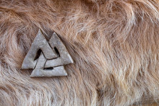 Stone valknut on Viking fur.