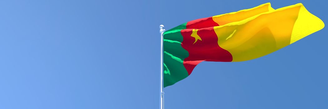3D rendering of the national flag of Cameroon waving in the wind against a blue sky