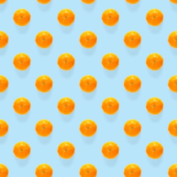 Fresh mandarin Seamles pattern. Ripe fruit tangerines seamless pattern. Fresh citrus isolated on blue background pattern. Flat lay of Clementine. Mandarine modern tropical seamless background.