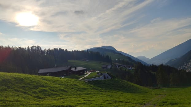 Val Gardena, Italy - 09/15/2020: Scenic alpine place with magical Dolomites mountains in background, amazing clouds and blue sky in Trentino Alto Adige region, Italy, Europe