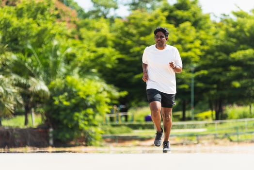 Asian young lifestyle athlete sport runner black man wear feet shoe active running training at the outdoor on the treadmill line road, healthy exercise workout