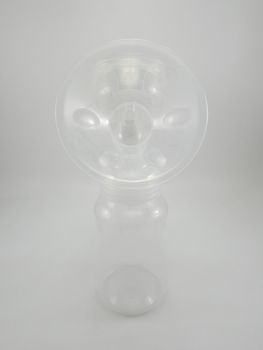 Clear plastic silicone breast pump use for lactating mother