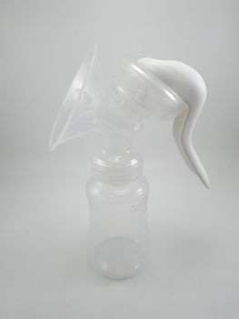 Clear plastic silicone breast pump use for lactating mother