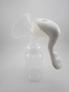 Clear plastic silicone breast pump use for lactating mother