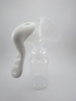 Clear plastic silicone breast pump use for lactating mother