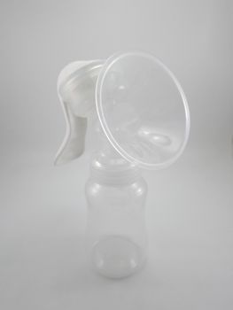 Clear plastic silicone breast pump use for lactating mother