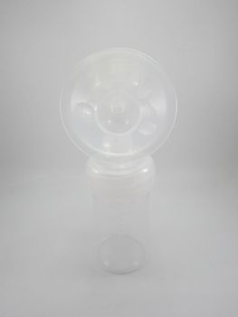 Clear plastic silicone breast pump use for lactating mother