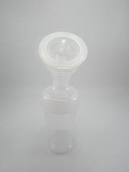 Clear plastic silicone breast pump use for lactating mother