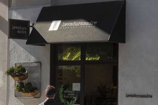 Madrid, Spain - May 18, 2020: Main facade at the entrance to the bakery, Levaduramadre, in the Retiro district.