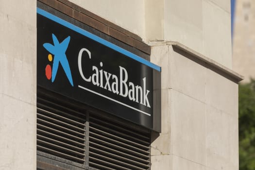 Madrid, Spain - May 18, 2020: Main facade at the entrance to the bank office of, CaixaBank, in the Retiro district.