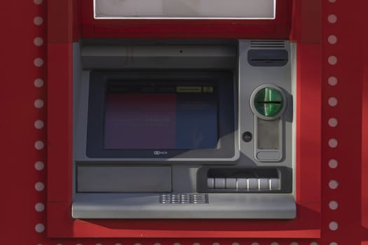 Madrid, Spain - May 18, 2020: An outdoor ATM machine, at the entrance to the bank office of, Santander, in the Retiro district.