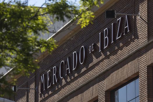 Madrid, Spain - May 19, 2020: The facade sign in the well-known local market for fruits, vegetables, fish, meats and other products on Ibiza street, in the Retiro district.