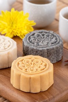 Colorful beautiful moon cake, mung bean cake, Champion Scholar Pastry cake for Mid-Autumn festival traditional gourmet dessert snack, close up.