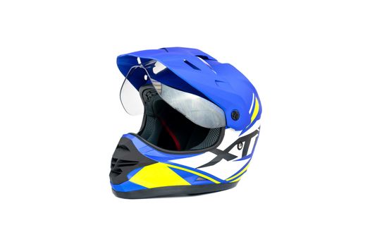 Multi colored motocross helmet isolated on white background.