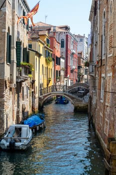 Small channel in the old town of Venice, Italy