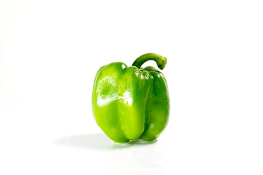 large fresh paprika green color isolated on white background.