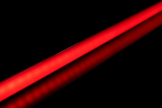 LED tube light bulb red color for photography and video on black background.