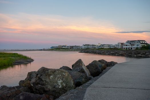A Concrete Path With an Orange and Blue Sunset Sky Behind It at the North Wildwood Sea Wall in Wildwood New Jersey