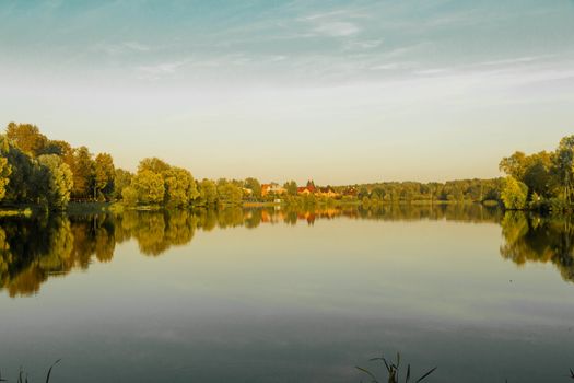 .View of the lakes in the park from the other side in the evening in autumn