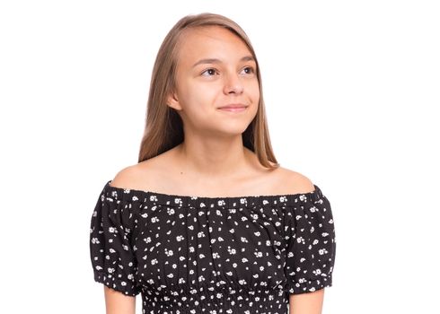 Beautiful teen girl smiling and looking away. Portrait of young pretty funny child, isolated on white background. Young happy teenager in studio.