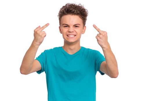 Portrait of angry teen boy showing middle finger. Caucasian child isolated on white background.