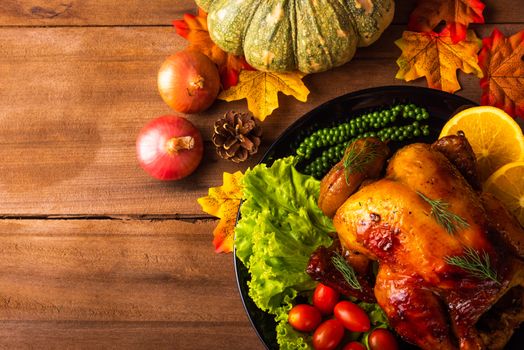 Thanksgiving baked turkey or chicken and vegetables, Christmas dinner feast food decoration, studio shot on wooden table background, Happy thanksgiving day of holiday concept