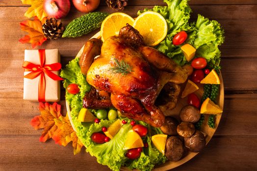 Thanksgiving roasted turkey or chicken and vegetables, Top view Christmas dinner feast food decoration traditional homemade on wooden table background, Happy thanksgiving day of holiday concept