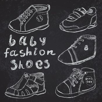 Baby fashion shoes set sketch handdrawn on blackboard.