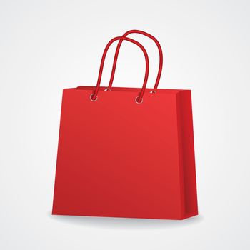 Realistic red shopping bag with rope handles on grey background.