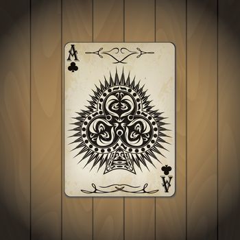 Ace of clubs poker cards old look varnished wood background.