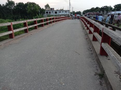 concrit bridge on river with nature