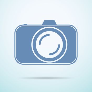 Professional photocamera flat icon on blue background.