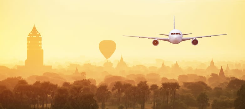 Front of real plane aircraft, on Pagoda Sunset in Bagan,Myanmar background