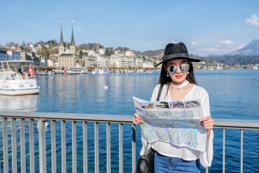 Young female tourist looking map at center city of Lucerne ,Switzerland