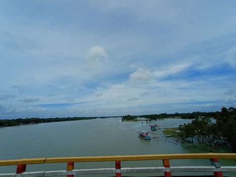 concrete bridge on river with sky