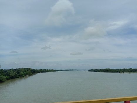 concrete bridge on river with sky